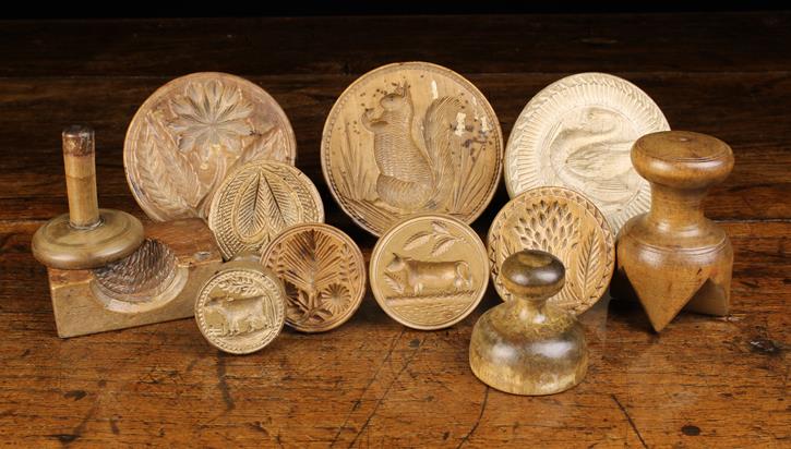 A Group of Twelve Fine 19th Century Butter Stamps ranging in size from 3½" (9 cm) in diameter to
