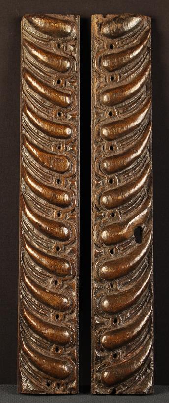 A Pair of 17th Century Oak Drawer Fronts carved in relief with gadrooning, 3¼" (8 cm) high,