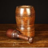 An 18th Century Turned Mahogany Mortar and an associated 19th Century pestle.