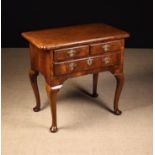 An 18th Century Walnut Lowboy.