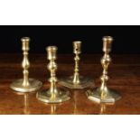Four Antique Brass Candlesticks: A 17th Century French stick with stub ejector hole pierced to the