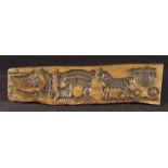 An 18th Century Carved Elm Gingerbread Moulded depicting a horse & carriage,