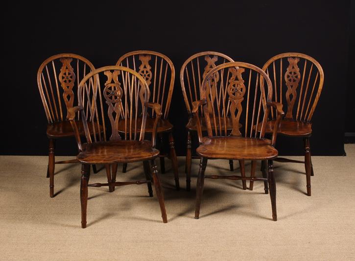 A Set of Six 19th Century Wheel-back Windsor Chairs comprising of two armchairs and four side