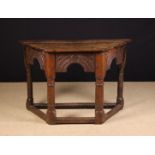A 17th Century Joined Oak Credence Table of canted form.