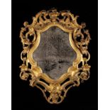 An 18th Century Carved Giltwood Wall Mirror.