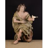 A Large 17th/18th Century Polychrome Wood Carving of an Angel with wavy windswept hair,