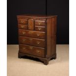 A Fine 18th Century Norfolk Chest of Drawers incorporating a small cupboard.