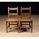 A Pair of 19th Century Oak Bar-backed Side Chairs with planked seats on square moulded legs united