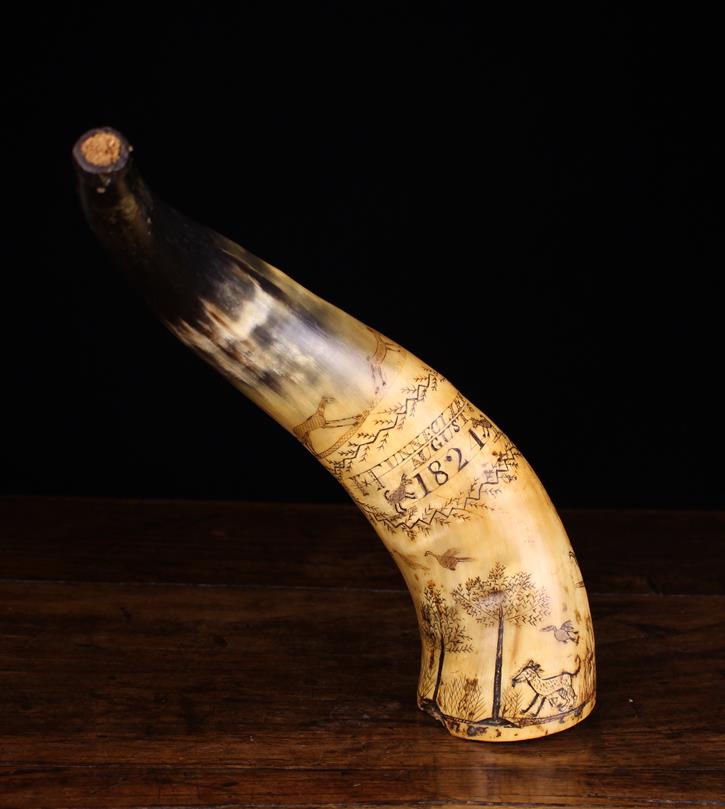 A Fabulous 19th Century Folk Art Engraved Cow Horn Powder Flask.