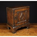A Late 17th Century Oak Spice Cupboard.