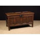 A 17th Century Joined Oak Triple Panel Coffer with nulled frieze rails and moulded framework,