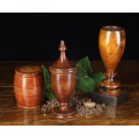 Three Pieces of Treen: A Late 18th Century Stained Boxwood Jar & Cover of barrel form,