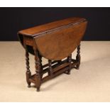 An 18th Century Oak Gateleg Table.