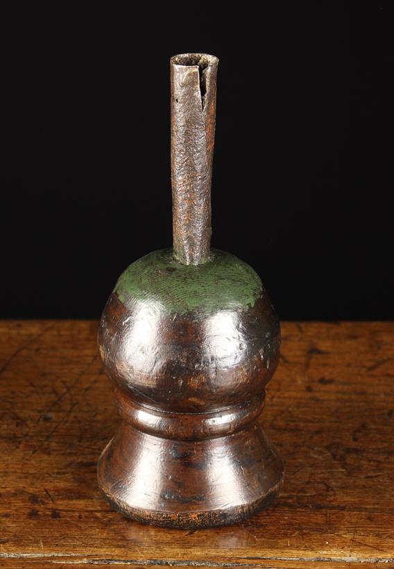 A Rare Early 18th Century Wrought Iron Candle Holder mounted on a treen base.