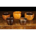 Five 19th Century Turned Lignum Vitae Flat-bottomed Bowls, varying in size ranging from 2½" (6.