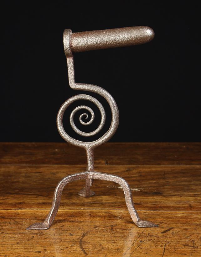 An 18th Century Welsh Wrought Iron Goffering Iron with a coiled scrollwork stem and tripod base