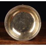 A French Silvered Brass Alms Dish with inscription around the narrow border dated 1809 and twin