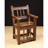 A 17th Century Spanish Walnut Armchair of fine colour and patination.