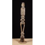 A Charles I Pierced Oak Newel Post carved with thistle decoration and mounted on a later stand,