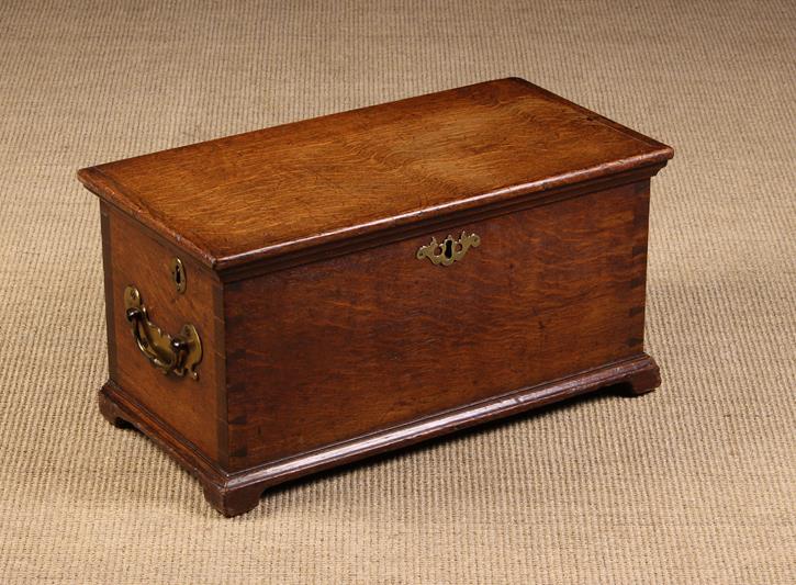 An 18th Century Oak Rent Box of through dove-tailed jointed construction.