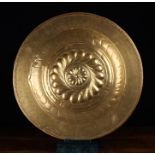 A Large 17th Century Brass Repoussé Alms Dish.