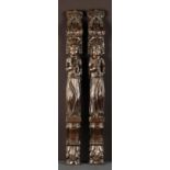 A Pair of Early 17th Century Appliqué Terms carved with a pair of saints: one holding an anchor,