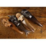 Four Vintage Black Forest Carved Treen Nut Crackers in the form of Gnomes' heads;
