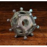 A Romanesque Verdigris Bronze Dodecahedron;