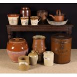 A Group of Earthenware & Tin Kitchen Vessels: A large partially glazed terracotta bread crock with