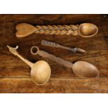 Four Carved Treen Love Spoons: A late 19th/early 20th century boxwood spoon with oval bowl on