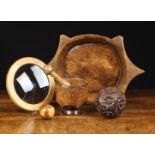 Five Pieces of 20th Century Treen & a framed magnifying glass lens: A dug-out dish with a