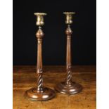 A Pair of Late 18th/Early 19th Century Fruitwood Candlesticks with original cast brass bobèches.