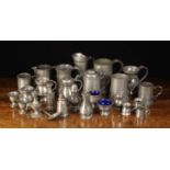 A Group of Antique Pewter, predominantly 19th century: five shakers, a spoon,