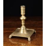 A Late 17th Century Spanish Brass Candlestick with ring turned socket,