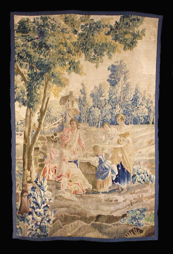 An 18th Century Aubusson Tapestry Fragment depicting a small gathering of figures in a rural