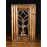 A 16th Century Pierced Tracery Panel with fluted columns flanking a Gothic 'window',