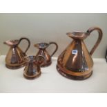 Four copper measuring jugs from 1/2 pint to 1 gallon, multiple dents to 1/2 pint others generally