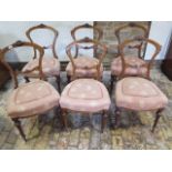 A set of six Victorian carved and inlaid dining chairs on fine reeded legs with overstuffed seats in
