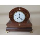 An inlaid mahogany mantle clock, 20cm tall, working, case in restored condition, chips to dial