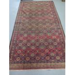 A hand knotted woollen Baluchi rug, 2.95m x 1.6m