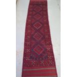 A hand knotted woollen Meshwani runner, 257cm x 62cm