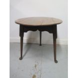 A Georgian and later elm side table on turned legs and pad feet with a shaped apron, 63cm tall x