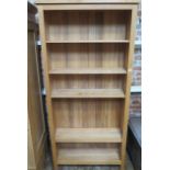 A modern oak bookcase with adjustable shelves, made by a local craftsman to a high standard, 202cm