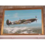 An oil on board Spitfire in flight by Paul James, signed DP James 3 1986, in a gilt frame overall