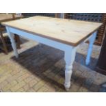 A Victorian style modern pine kitchen table with a painted base, 78cm tall x 152cm x 90cm