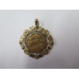 A George V gold full sovereign, dated 1927 in a 9ct pendant mount, total weight approx 15 grams
