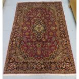 A hand knotted woollen Kashan rug, 2.00m x 1.35m