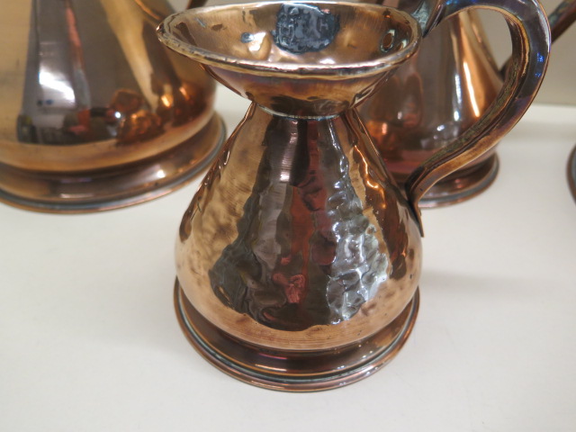 Four copper measuring jugs from 1/2 pint to 1 gallon, multiple dents to 1/2 pint others generally - Image 2 of 2