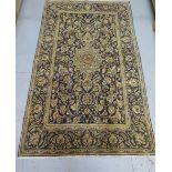 A hand knotted woollen Kashan rug, 2.20m x 1.32m