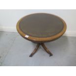 A round leather top Georgian style occasional table, 51cm x 60cm